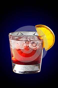 Cocktail with grenadine juice and lemon