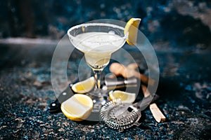 Cocktail with lemons and vodka. Margarita refreshment drink and cocktails photo