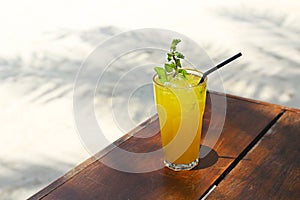 Cocktail Mai Tai with Light rum, dark rum, Orange Curacao, almond syrup, lime, ice cubes, pineapple and mint