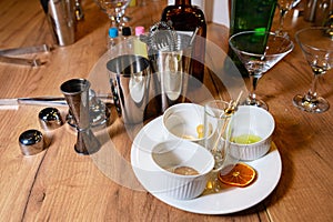 Cocktail Making Set with Citrus Garnishes on Wood