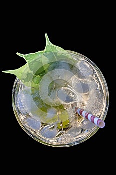 Cocktail mojito with straw top view ice lemon straws in an expensive bar restaurant, in tropical beach balearic Islands, mojito