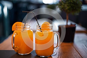 Cocktail in mug with oranges slice. Mug delicious refreshing drink with orange