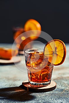 Cocktail old fashioned with hard light and harsh shadows