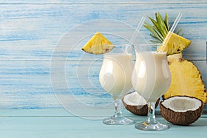 Cocktail Pina Colada. Pina Colada refreshing summer alcoholic cocktail with coconut milk and pineapple juice nearby. summer drink.