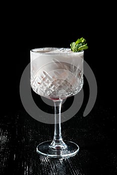 Cocktail Pina Collada. Garnished with a leaf of mint. photo