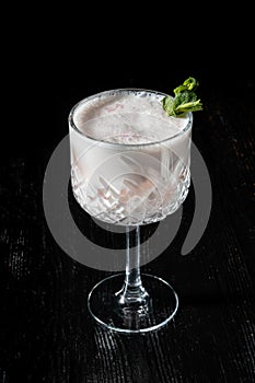 Cocktail Pina Collada. Garnished with a leaf of mint. photo