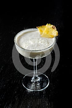 Cocktail Pina Collada. Garnished with a slice of pineapple. photo