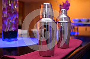 Cocktail shakers in an upscale bar