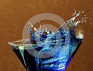 Cocktail splash of blue liquid.