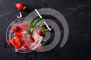 Cocktail strawberry margarita on the slate dark background, copy space. Flat lay