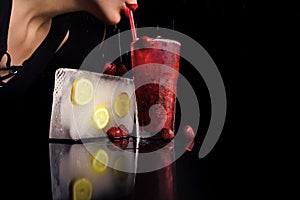 Cocktail with strawberry for young girl with red lips.