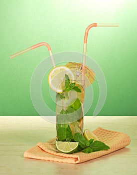 Cocktail, umbrella and lemon, mint, napkin