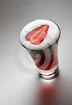 Cocktail with whipped cream & strawberries