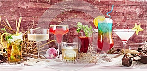 Cocktails against red wooden background