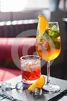 Cocktails with fruits and berries served on a table in restaurant or bar. Alcoholic beverage