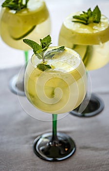 Cocktails with lime, elderflower syrup and ice