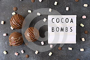 Cocoa bombs with marshmallows, chocolate that melts when hot milk is added for creating a trendy tasty drink. Food