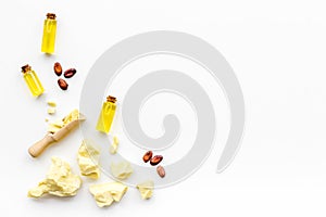 Cocoa butter as ingredient for natural cosmetics. White background top view copy space