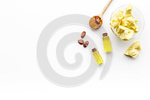 Cocoa butter as ingredient for natural cosmetics. White background top view copy space