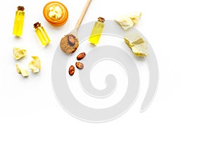 Cocoa butter as ingredient for natural cosmetics. White background top view copy space