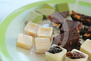 Cocoa butter, pale yellow edible fat extracted from cocoa bean photo