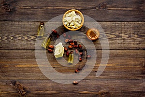 Cocoa butter for skin care. Dark wooden background top view copy space