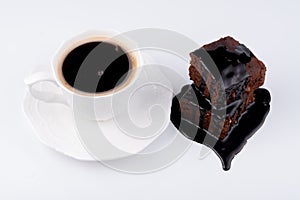 Cocoa cake and chocolate sauce and coffee