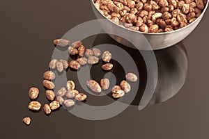 Cocoa coated puffed rice in metal bowl