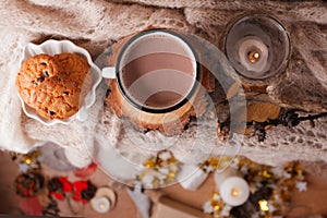 Cocoa with Cozy winter home background, cup of hot cacao with american cookies, warm knitted sweater on vholiday decoration blur