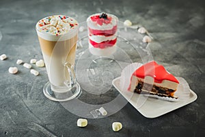 Cocoa milkshake drink and berry desserts. Milkshakes and sweet cake