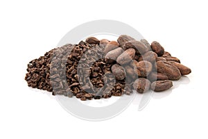 Cocoa pods and cocoa beans and cacao powder with leaves isolated on white background