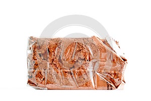 cocoa powder in plastic packaging with date of production isolated on white background