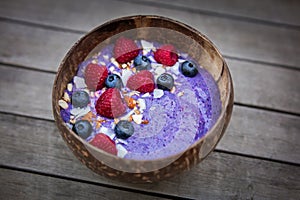 Coconut bowl with blueberries raspberries and coconut