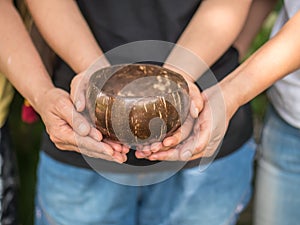 Coconut bowl on hands