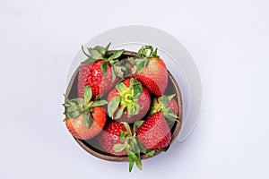 Coconut Bowl with Juicy Fresh Ripe Red Strawberries on Blue Background Tasty Berry Top View