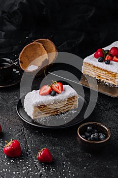 Coconut Cake slice with strawberries and blueberries