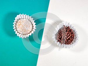 Coconut Candy and Brigadier's sweet (Beijinho and Brigadeiro, in portuguese) on blue and white background.