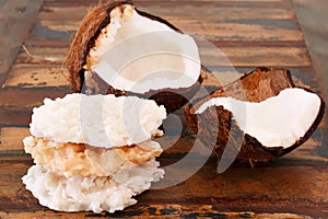 Coconut candy cocada with coconut on wooden table