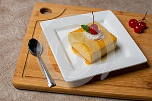coconut cheesecake dessert with cereza in a table photo