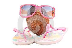 Coconut concept with sunglasses and beachwear