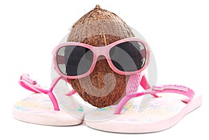 Coconut concept for travel agency with sunglasses and beachwear