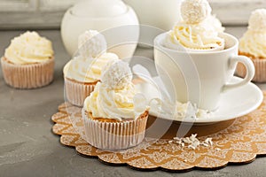 Coconut cupcakes with white frosting