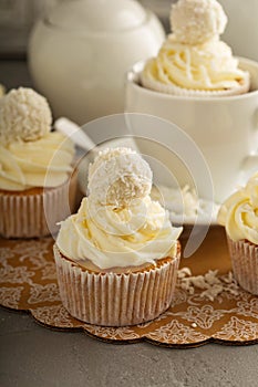Coconut cupcakes with white frosting