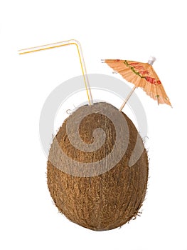 Coconut drink, cocos with a straw and umbrella