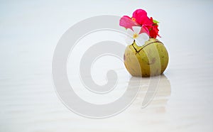 Coconut drink decorated with flowers