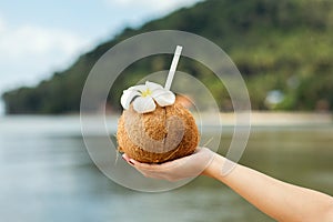 Coconut drink in hand