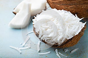 Coconut flakes in a shell on a blue background