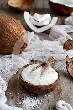 Coconut flour in a wooden bowl close up