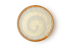 Coconut flour in wooden bowl on white background