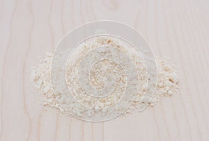 Coconut flour on wooden plate